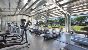 A covered gym area with treadmills and elliptical machines. - Royal Palm: AC, Private Lanai, Walk to Poipu Beach (Koloa)