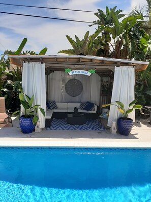 Outdoor pool, a heated pool - The Place,  a beautiful  private and quiet, cozy, room with microwave refrig.  (Fort Lauderdale)