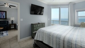 A bedroom with a bed, a television, a dresser, and a ceiling fan. - Beautiful 3 Br 3B Gulf Front With Free Wifi Tennis, Pickle Ball, 2 Pools (Orange Beach)