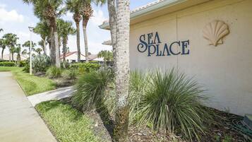 A building with a sign reading "SEA PLACE" and a shell emblem.