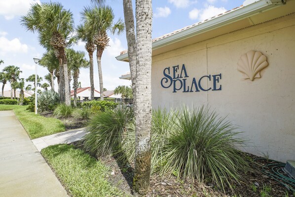 A building with a sign reading "SEA PLACE" and a shell emblem.
