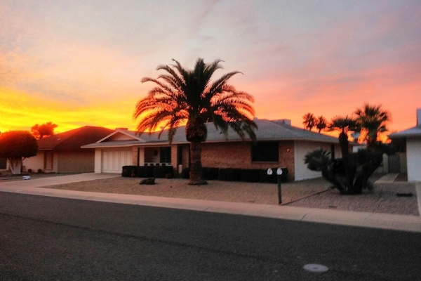 Front of house with sunset