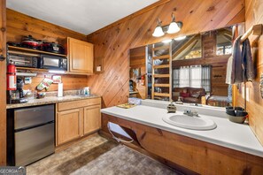 Fridge, microwave, stovetop, coffee/tea maker