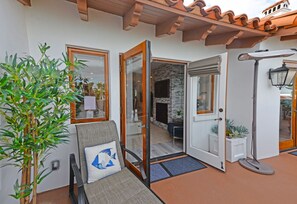 Relax in a stylish living area with a comfortable sofa, decorative pillow, and potted plant.