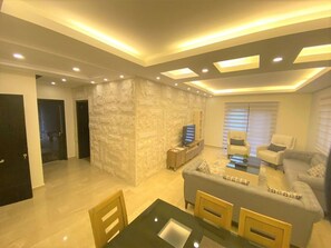 Luxury Apartment, Mountain View | Living area | 50-inch flat-screen TV with satellite channels, LED TV, DVD player