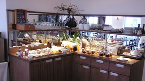 A buffet area with various food items and a coffee station. - Hotel zur Promenade (Donauwoerth)