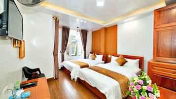 Premier Quadruple Room, 2 Queen Beds, City View | Minibar, in-room safe, individually decorated, individually furnished