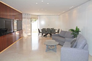 Apartment, 3 Bedrooms | Living area | Flat-screen TV