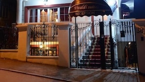 A two-story building with a reception area and a balcony.