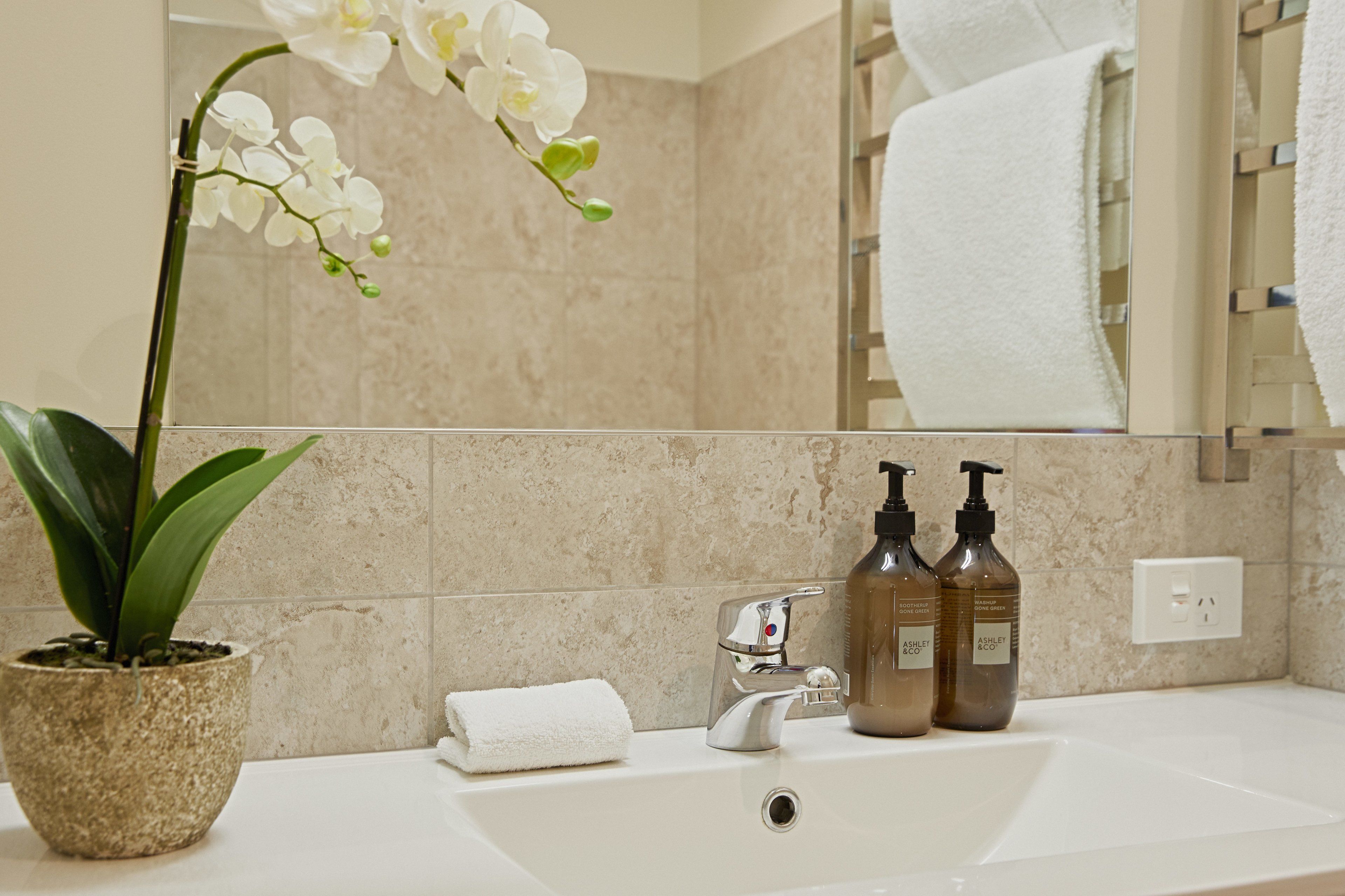 king studio | bathroom | designer toiletries, hair dryer, towels