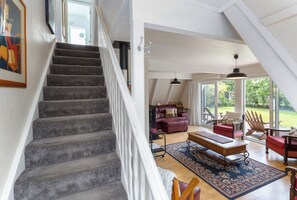 A staircase leading to a living area with a view of the outdoors. - The house for all seasons, occasions and ages. Perfect for families! (Greytown)