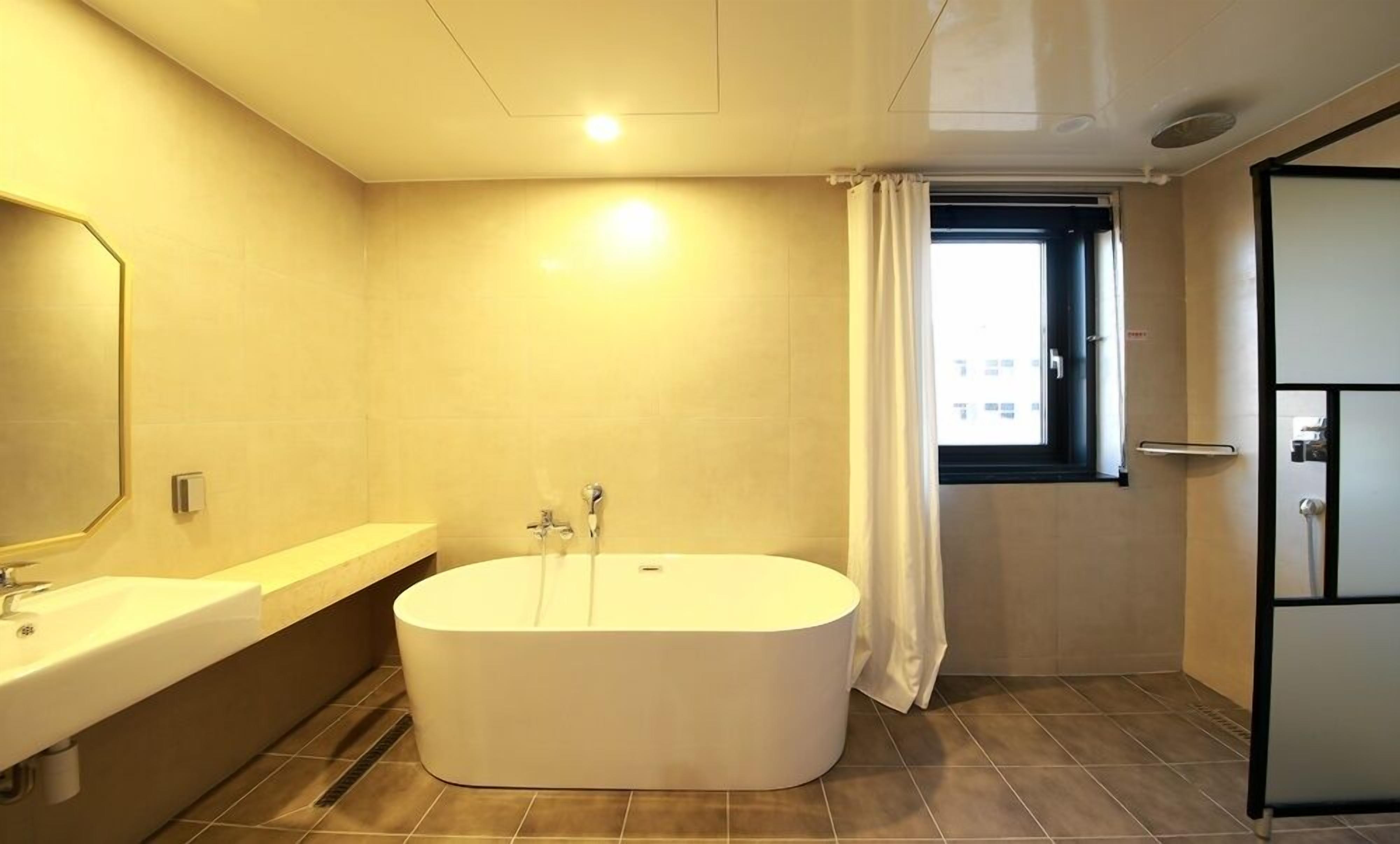 premium twin room | bathroom | free toiletries, hair dryer, bathrobes, slippers