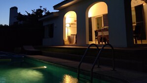 A modern house with a swimming pool, featuring a patio with outdoor furniture and a staircase leading to the entrance. - 4 bedrooms Villa with pool, Sea view - 3 min walk to Binibeca vell (Binibequer)
