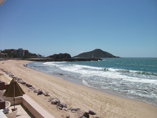 On the beach, sun-loungers, beach towels