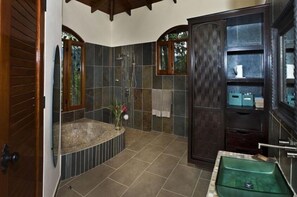 Bathtub, eco-friendly toiletries, hair dryer, towels
