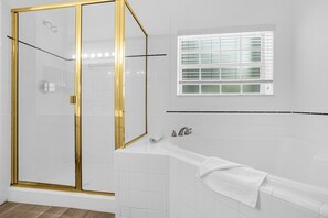 Combined shower/tub, hair dryer, towels, soap
