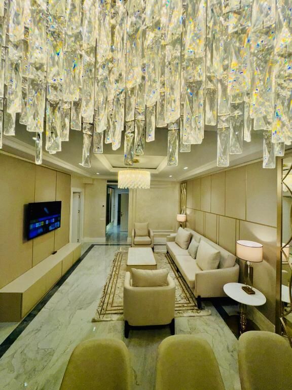 Business Suite | Living area | 85-cm plasma TV with cable channels, TV