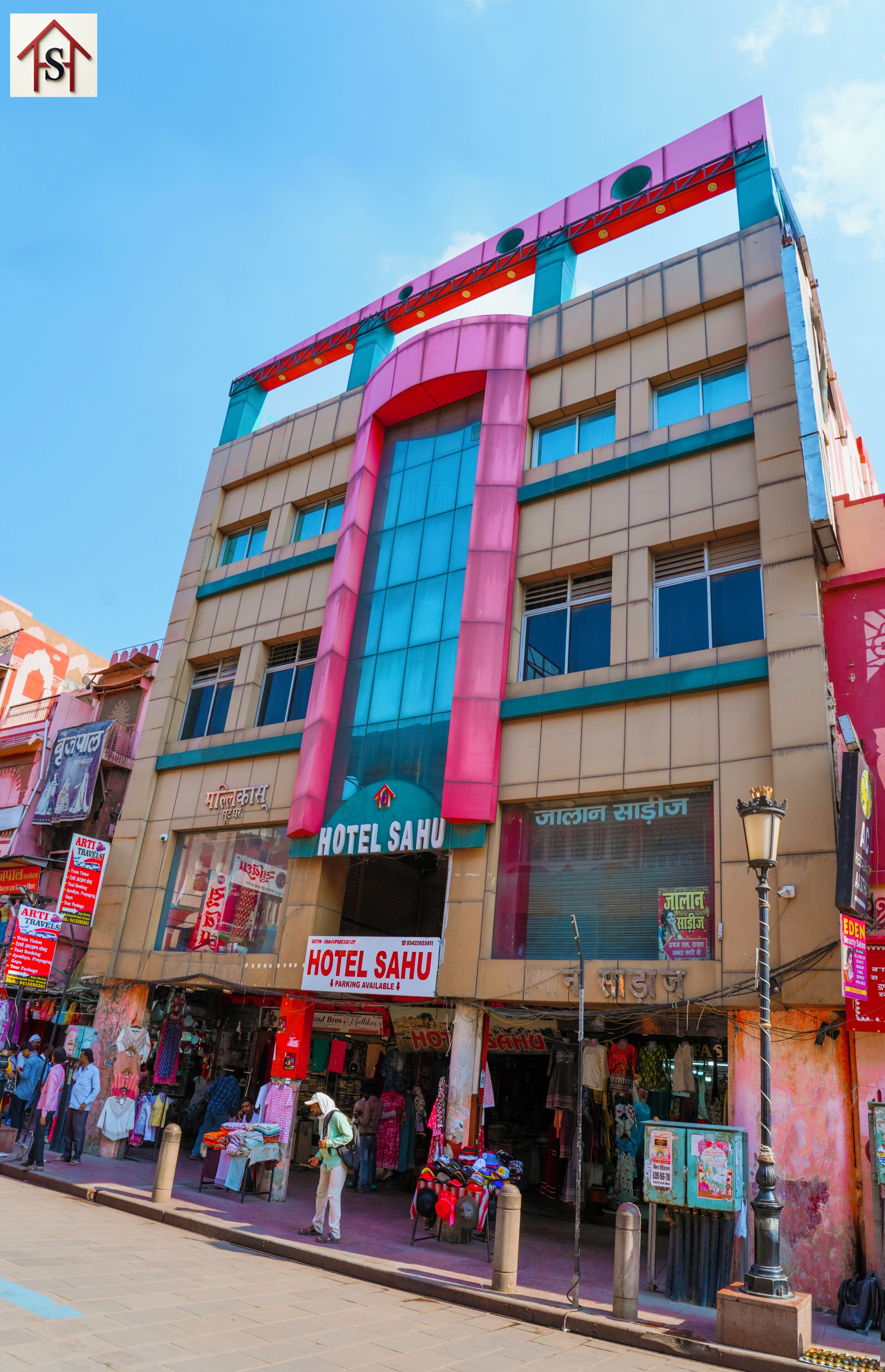 A multi-story building with a prominent sign for 'HOTEL SAHU' and a visible entrance.