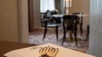 A table with lined paper and pens.