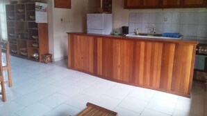 Comfort House, Multiple Beds, Non Smoking, Garden View | Private kitchen | Coffee/tea maker, fridge, microwave, oven - Vince House (Kribi)