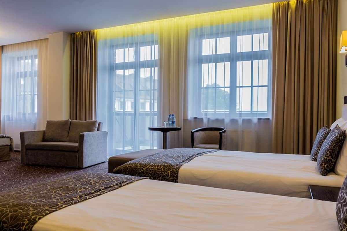 superior room | in-room safe, desk, blackout curtains, iron/ironing board