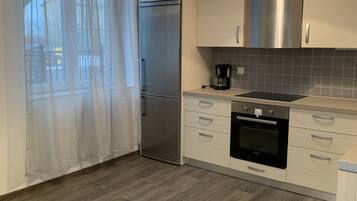 Apartment, 2 Bedrooms | Private kitchen | Fridge, oven, stovetop, coffee/tea maker