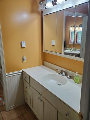Combined shower/bathtub, towels, soap, toilet paper