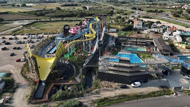 An aerial view of a water park with multiple slides and a large pool area. - 4-STAR VILLA TORREILLES SEASIDE RESORT (TORREILLES)