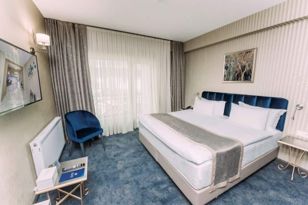 Deluxe tweepersoonskamer | Luxe beddengoed, een kluis op de kamer, geluiddichte muren, gratis wifi
