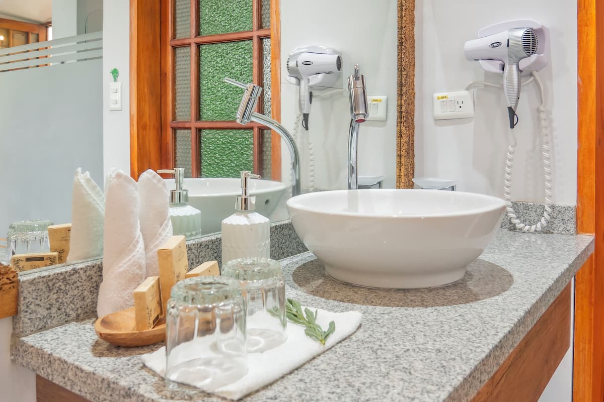 luxury room | bathroom | shower, eco-friendly toiletries, hair dryer, bathrobes
