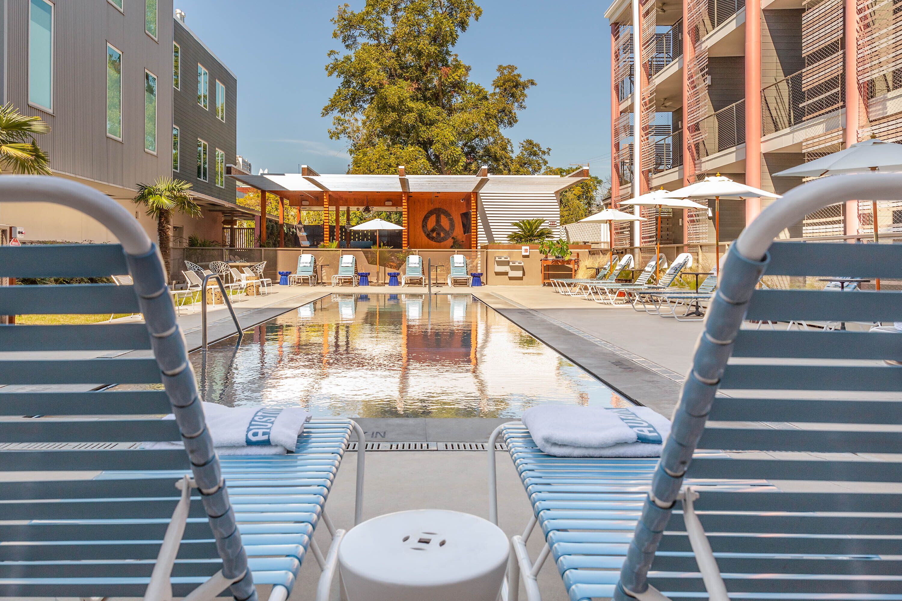 outdoor pool, open 8:00 am to 10:00 pm, pool umbrellas, pool loungers
