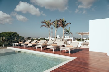 2 outdoor pools, pool umbrellas, sun loungers at Antera Hotel & Residences