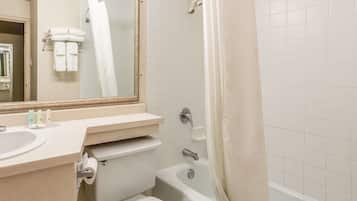 A bathroom with a sink, toilet, and bathtub.