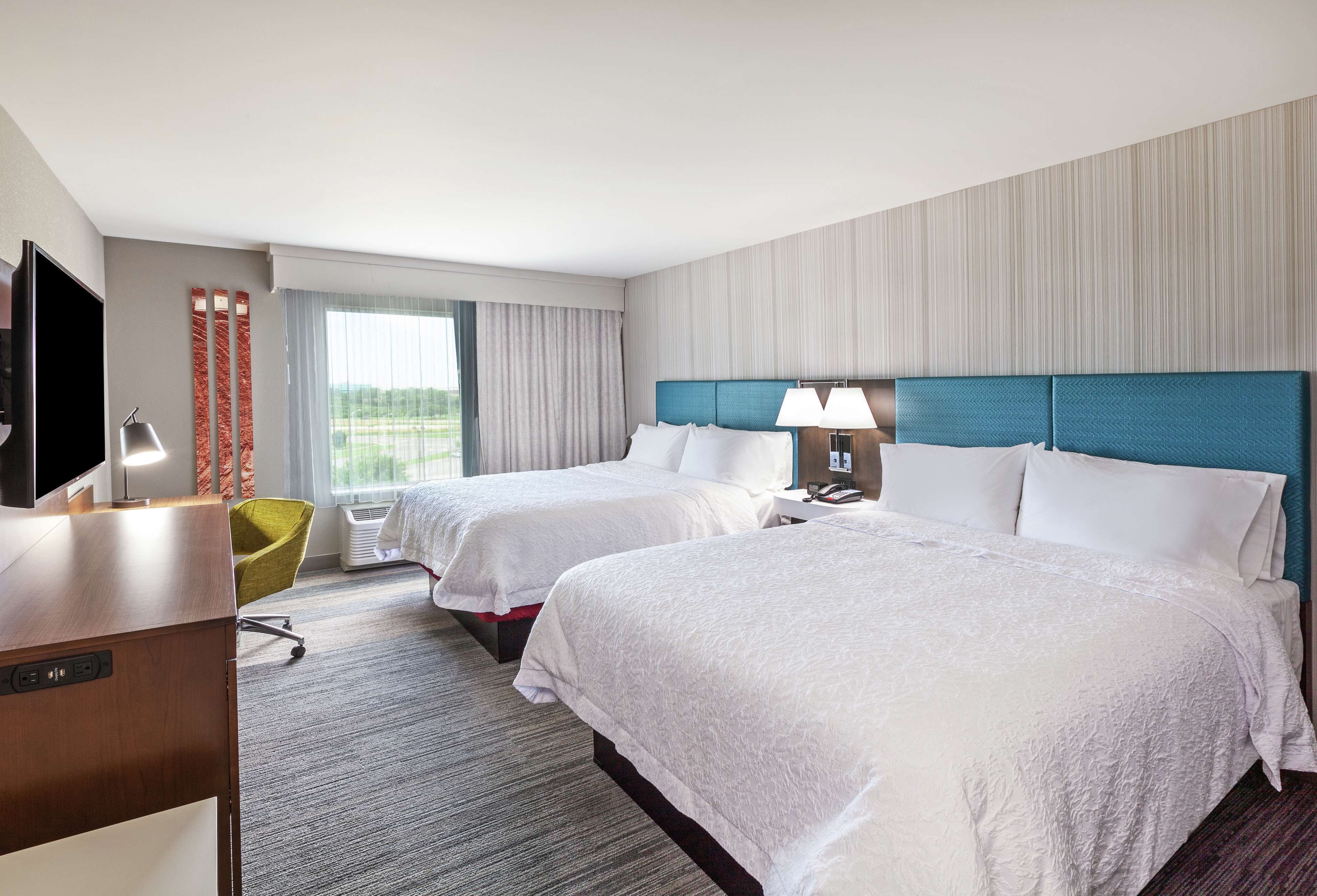 room, 2 queen beds, refrigerator | premium bedding, in-room safe, free cots/infant beds, free rollaway beds