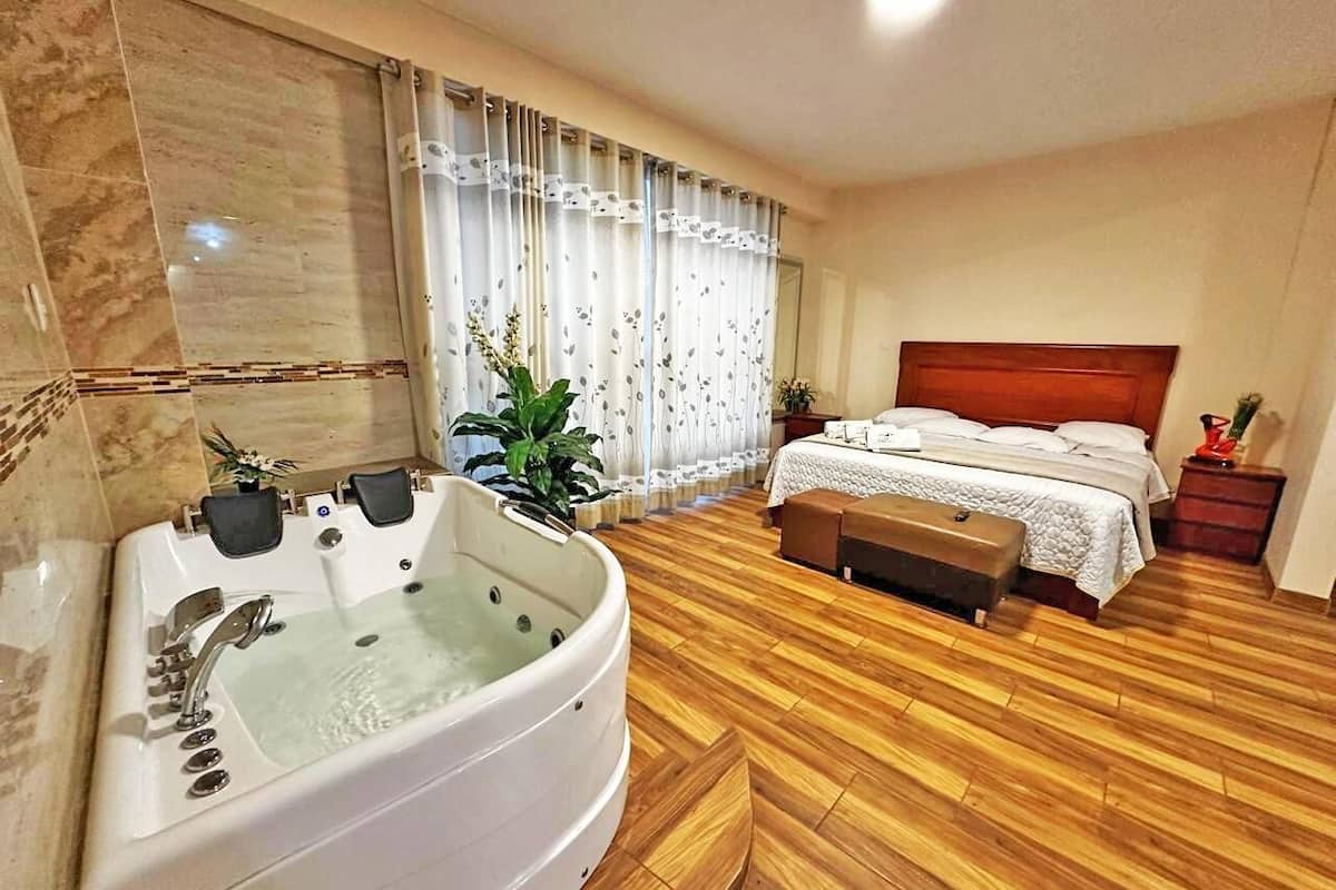 Suite, 1 Queen Bed | Iron/ironing board, free WiFi, bed sheets