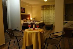 Suite, 1 Queen Bed | Iron/ironing board, free WiFi, bed sheets