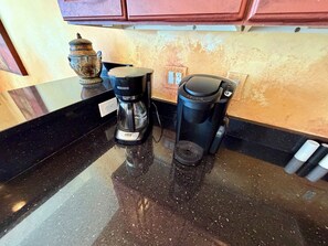 A kitchen counter with a coffee maker and a Keurig coffee pod dispenser. - Panoramic Ocean Views, 2 Large Decks, and Direct Beach Access! (North Wildwood)