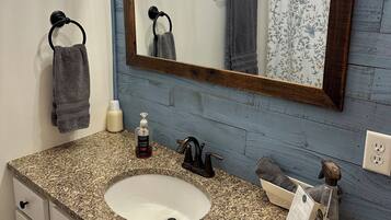 Combined shower/tub, hair dryer, towels, soap