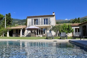 Outdoor pool, a heated pool, pool loungers