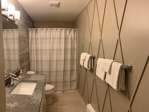 Combined shower/bathtub, hair dryer, towels, soap - Cozy, ground floor suite, with private hot tub - backs onto chairlift. (Silver Star Mountain)
