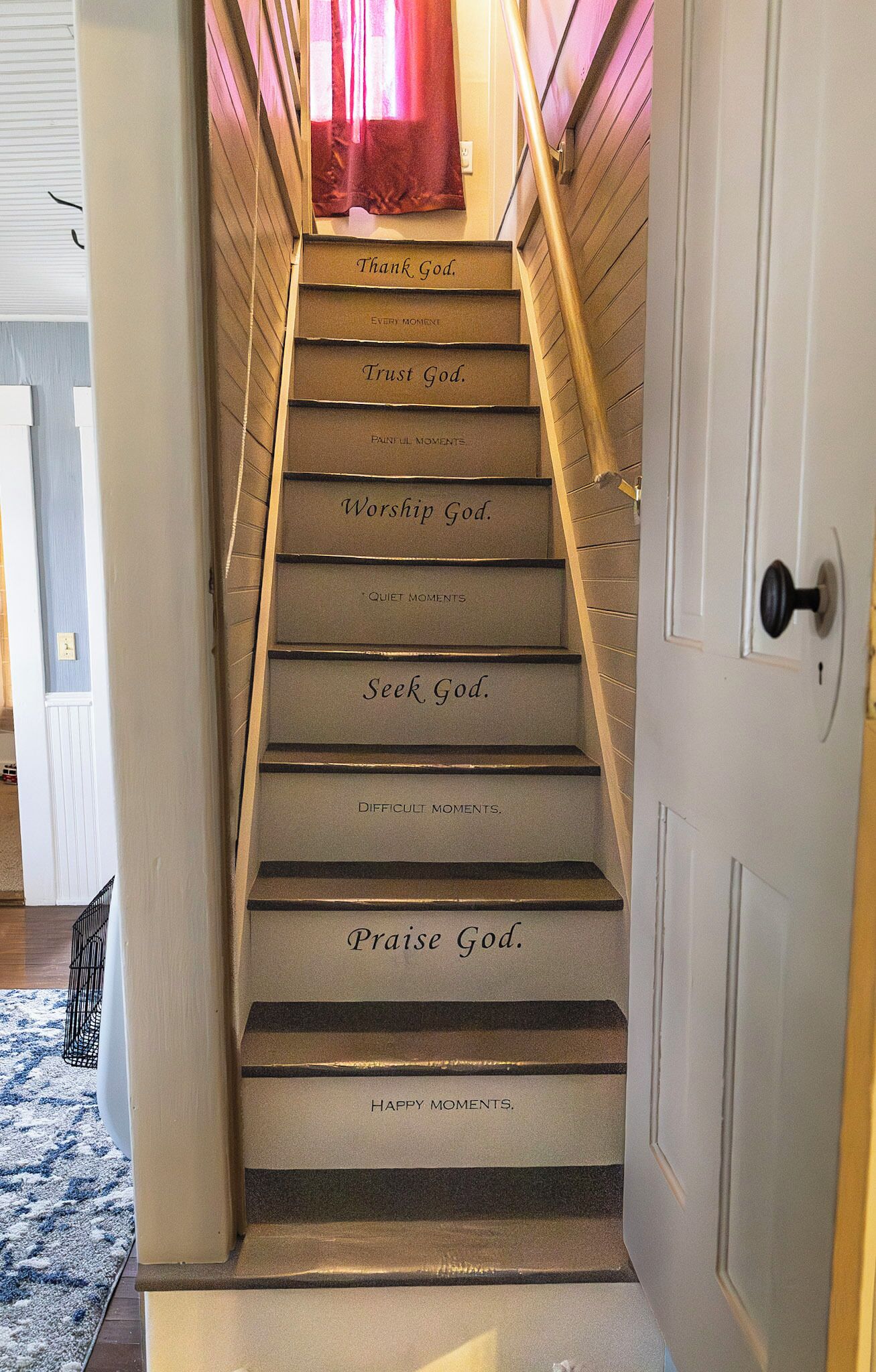 A staircase with steps labeled with phrases like 'Thank God.' and 'Seek God.'