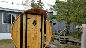 A sauna with a wooden exterior and a sign that reads "Sauna". - Lake Superior Home - Perfect for a family vacation any time of the year! (Calumet)