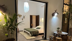 A cozy room with a bed, a small table with chairs, and a potted plant. - House / Villa - MarrakechHouse with garden (Marrakesh)