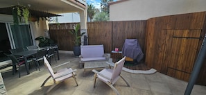 Enjoy an outdoor space with a covered seating area, barbecue grill, and exercise equipment.