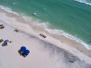 On the beach, sun-loungers