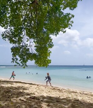 On the beach, beach towels - 'Cheez Don Bread' is a Beach Front Accommodation on Long Beach Barbados. (Christ Church)