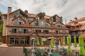Guests can enjoy outdoor space from every floor, with a patio area offering tables and chairs for dining or relaxation.