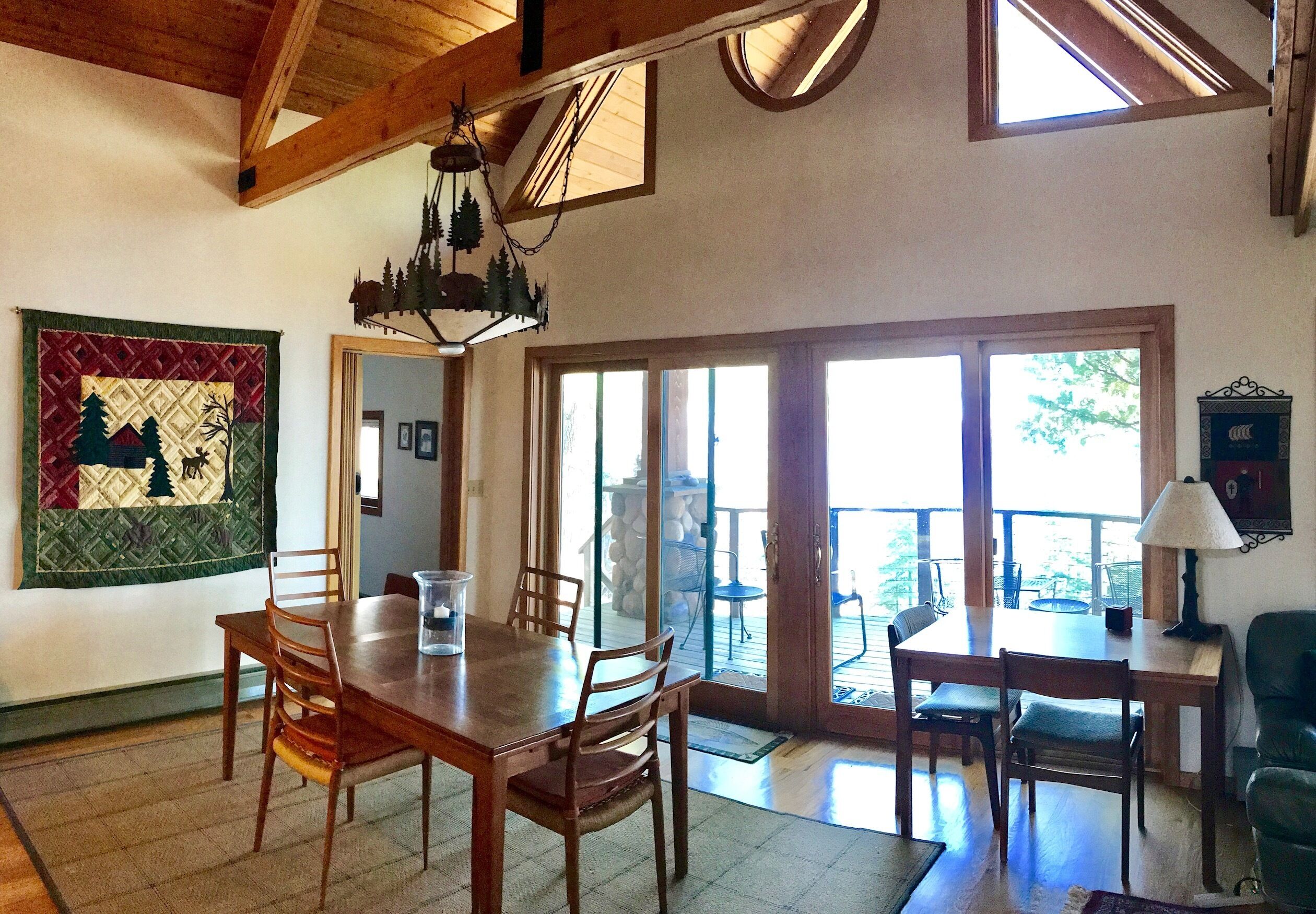 Dining area and access to the deck which face the lake.