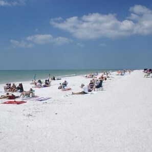 On the beach, sun loungers, beach towels