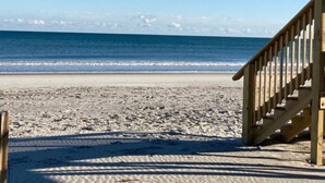 A wooden staircase leading to a beach with a clear view of the ocean. - Fantastic place to make memories. Great ocean view condo for fun & “GOOD TIMES” (Pawleys Island)